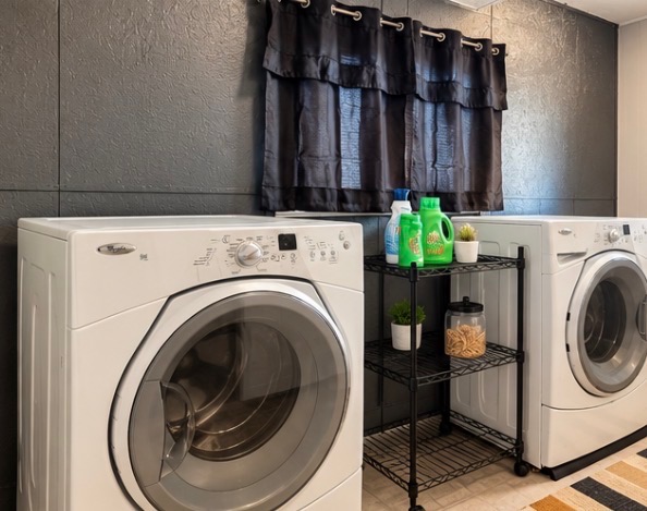 Laundry room with a front-loading washer and dryer
